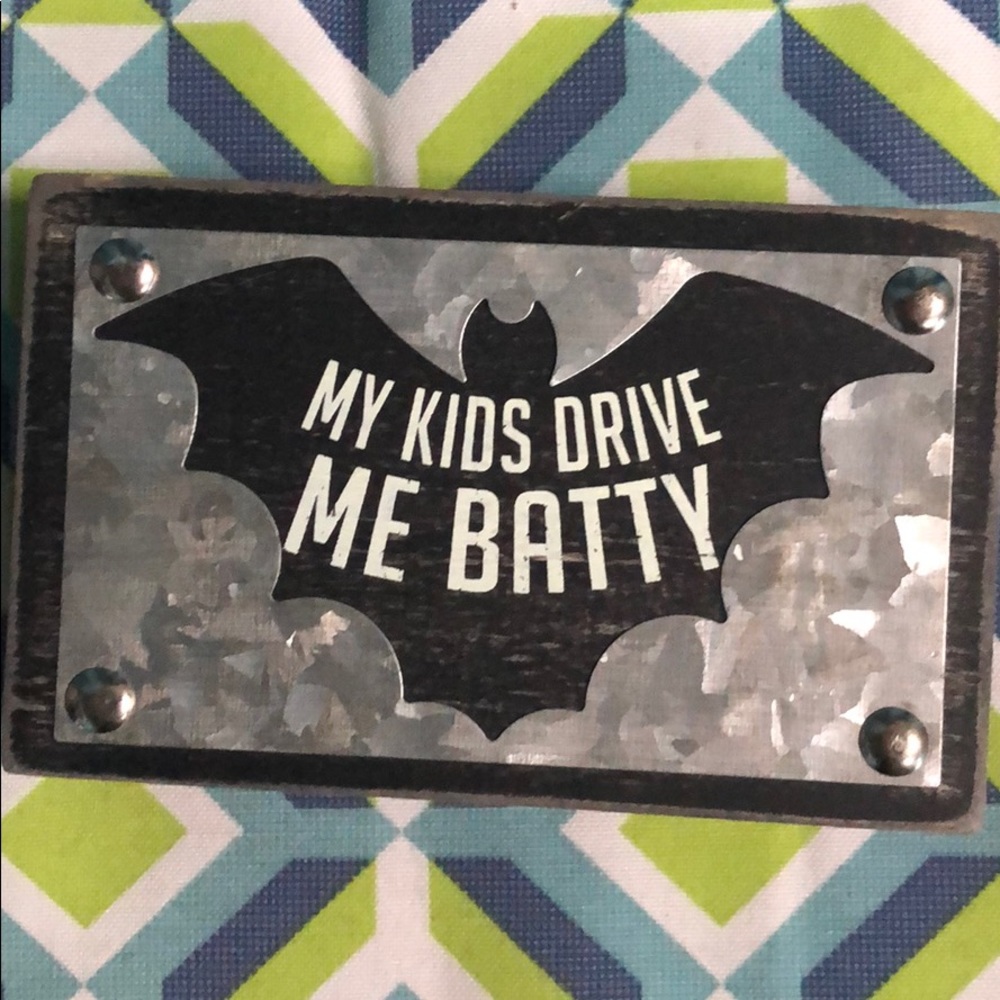Batty wood and metal sign.